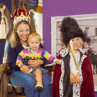 Family posing in Royal family themed dress up